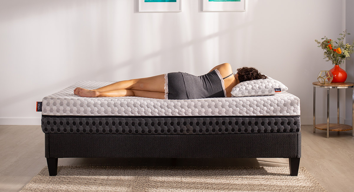 Woman laying on a mattress