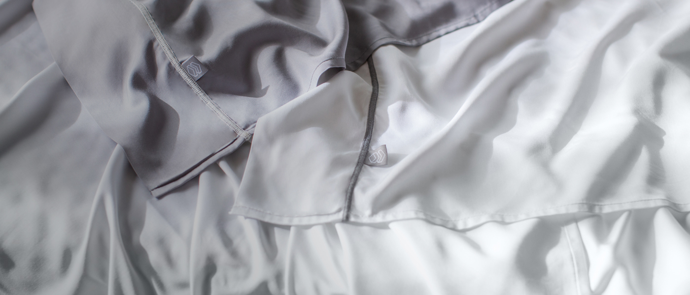 Close up of white and gray flat sheets